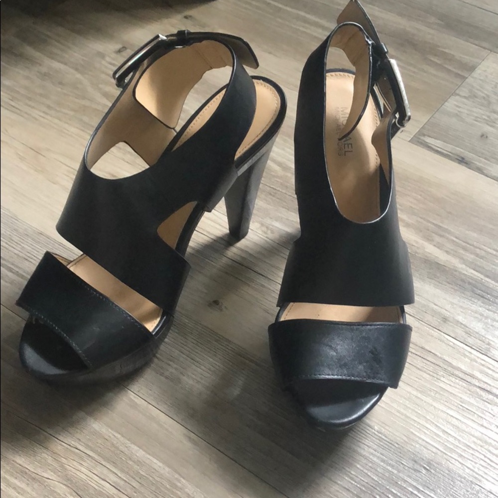 Micheal Kohrs black thick-strap heels.